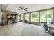 Sunroom featuring tile flooring, ceiling fan, and access to the outdoor space at 4224 Firwood Ln, Charlotte, NC 28209