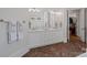 Bathroom featuring double sinks, a herringbone floor, and access to a walk-in closet at 503 Walnut St, Davidson, NC 28036