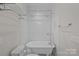 Classic bathroom featuring a clawfoot tub with white subway tile surround at 503 Walnut St, Davidson, NC 28036