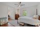 Bedroom with neutral walls and decor and a window with curtains at 503 Walnut St, Davidson, NC 28036