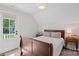 Cozy bedroom featuring a comfortable bed and access to a private outdoor space at 503 Walnut St, Davidson, NC 28036