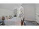 Bedroom with neutral walls and carpet and a window with curtains at 503 Walnut St, Davidson, NC 28036