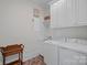 Laundry room with sink, basket and white washer and dryer at 503 Walnut St, Davidson, NC 28036
