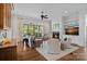 Bright living room with hardwood floors, fireplace, built-ins, and a large sliding glass door at 503 Walnut St, Davidson, NC 28036