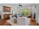 Open concept living room with hardwood floors, fireplace, and outdoor access at 503 Walnut St, Davidson, NC 28036