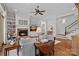 Cozy living room with a brick fireplace, built-in bookshelves, and comfortable seating at 503 Walnut St, Davidson, NC 28036
