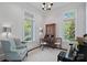 Bright office featuring large windows, a writing desk and hardwood floors at 503 Walnut St, Davidson, NC 28036