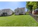 Spacious backyard showcasing lush green lawn and mature trees at 5035 Terrier Ln, Fort Mill, SC 29707
