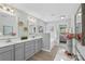 Stylish bathroom features dual sinks, modern fixtures, and a separate tub and vanity area at 5035 Terrier Ln, Fort Mill, SC 29707
