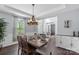 Inviting dining room with ample natural light, hardwood floors, and modern decor at 5035 Terrier Ln, Fort Mill, SC 29707
