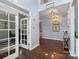 Open foyer with hardwood floors, natural light, and view of living spaces at 5035 Terrier Ln, Fort Mill, SC 29707