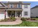 Charming front porch with stylish decor, seating, and attractive landscaping details at 5035 Terrier Ln, Fort Mill, SC 29707