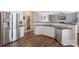 Spacious kitchen with stainless steel appliances, wood floors, and an open layout at 5035 Terrier Ln, Fort Mill, SC 29707