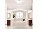 Bright bathroom features a soaking tub, a vanity, neutral tile, and picture window at 548 Fairwoods Dr, Huntersville, NC 28078
