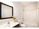 This bathroom features white cabinets, light walls, tile flooring, and a shower and tub combo at 548 Fairwoods Dr, Huntersville, NC 28078