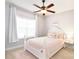 This bedroom features light-colored walls, carpet, a pink bed with pink bedding and one window at 548 Fairwoods Dr, Huntersville, NC 28078