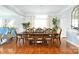 Elegant dining room featuring hardwood floors, a stylish light fixture, and plenty of natural light at 548 Fairwoods Dr, Huntersville, NC 28078