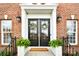 Inviting double front doors accented with wreaths and decorative lanterns create a warm welcome at 548 Fairwoods Dr, Huntersville, NC 28078