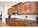 Well-appointed kitchen featuring dark countertops, custom cabinetry, and modern appliances at 548 Fairwoods Dr, Huntersville, NC 28078