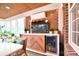 Inviting sunroom featuring brick accents and a convenient beverage cooler at 548 Fairwoods Dr, Huntersville, NC 28078