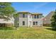 Backyard view of house with light siding and windows at 5611 Hammermill Dr, Harrisburg, NC 28075