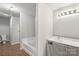 Clean bathroom with shower and tub combination and large vanity at 5611 Hammermill Dr, Harrisburg, NC 28075
