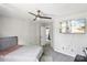 Bedroom with ceiling fan, gray walls and carpet, and television at 5611 Hammermill Dr, Harrisburg, NC 28075