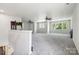 Spacious bonus room with multiple windows and ceiling fans at 5611 Hammermill Dr, Harrisburg, NC 28075