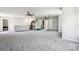 Large bonus room with plush carpet and ceiling fans at 5611 Hammermill Dr, Harrisburg, NC 28075