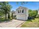 Charming home featuring a well-kept lawn, and a convenient two-car attached garage at 5611 Hammermill Dr, Harrisburg, NC 28075