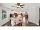 This open concept kitchen features an island with butcher block countertop, seating, and stainless steel appliances at 5611 Hammermill Dr, Harrisburg, NC 28075
