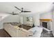 Open living room featuring hardwood floors, stone fireplace, large sectional and recessed lighting at 5611 Hammermill Dr, Harrisburg, NC 28075
