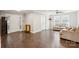 Inviting living room with hardwood floors, neutral walls, and a bright, welcoming atmosphere at 5611 Hammermill Dr, Harrisburg, NC 28075
