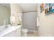 A bright bathroom features a vanity, commode and shower with soft white and gray colored accents at 599 Annalinde Ln, Rock Hill, SC 29732