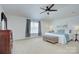 Bright and spacious bedroom with soft carpet, neutral colors, and a large window at 599 Annalinde Ln, Rock Hill, SC 29732