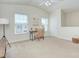 Bright bonus room is spacious with a vaulted ceiling, large windows and neutral colored walls at 599 Annalinde Ln, Rock Hill, SC 29732