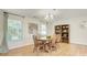 Cozy dining room featuring a wooden table with chairs, a chandelier, and natural lighting at 599 Annalinde Ln, Rock Hill, SC 29732