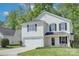 Charming two-story home featuring a two-car garage, neat landscaping, and a welcoming front porch at 599 Annalinde Ln, Rock Hill, SC 29732