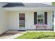 Inviting front porch with decorative wreath, bench seating, and stylish accents at 599 Annalinde Ln, Rock Hill, SC 29732