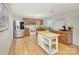 Spacious kitchen featuring stainless steel refrigerator and wooden cabinets and a center island on wooden floors at 599 Annalinde Ln, Rock Hill, SC 29732