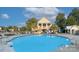 Community pool area featuring a large pool, sundeck, and clubhouse in a residential neighborhood at 599 Annalinde Ln, Rock Hill, SC 29732