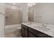 Bathroom featuring double sinks, quartz countertops, and a tub shower combo at 6114 Alsace Ln, Indian Land, SC 29707