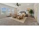Bright bedroom with a ceiling fan, neutral decor, and large windows bringing in natural light at 6114 Alsace Ln, Indian Land, SC 29707