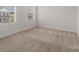 Neutral bedroom with plush carpet and two bright windows at 6114 Alsace Ln, Indian Land, SC 29707