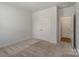 Bedroom features plush carpet, closet, and white trim throughout at 6114 Alsace Ln, Indian Land, SC 29707
