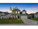 Charming two-story home with blue siding, a two-car garage, and a welcoming front porch in a well-kept neighborhood at 6114 Alsace Ln, Indian Land, SC 29707