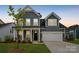 Charming two-story home with blue siding, a two-car garage, and a welcoming front porch in a well-kept neighborhood at 6114 Alsace Ln, Indian Land, SC 29707