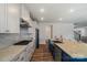 Spacious kitchen with stainless steel appliances, gas range, tile backsplash, and island with bar seating at 6114 Alsace Ln, Indian Land, SC 29707
