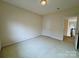 Bedroom with carpeted floors and a view into the hallway at 6316 Glengarrie Ln, Huntersville, NC 28078