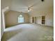 Large bedroom featuring a ceiling fan, carpet, and built in shelves at 6316 Glengarrie Ln, Huntersville, NC 28078